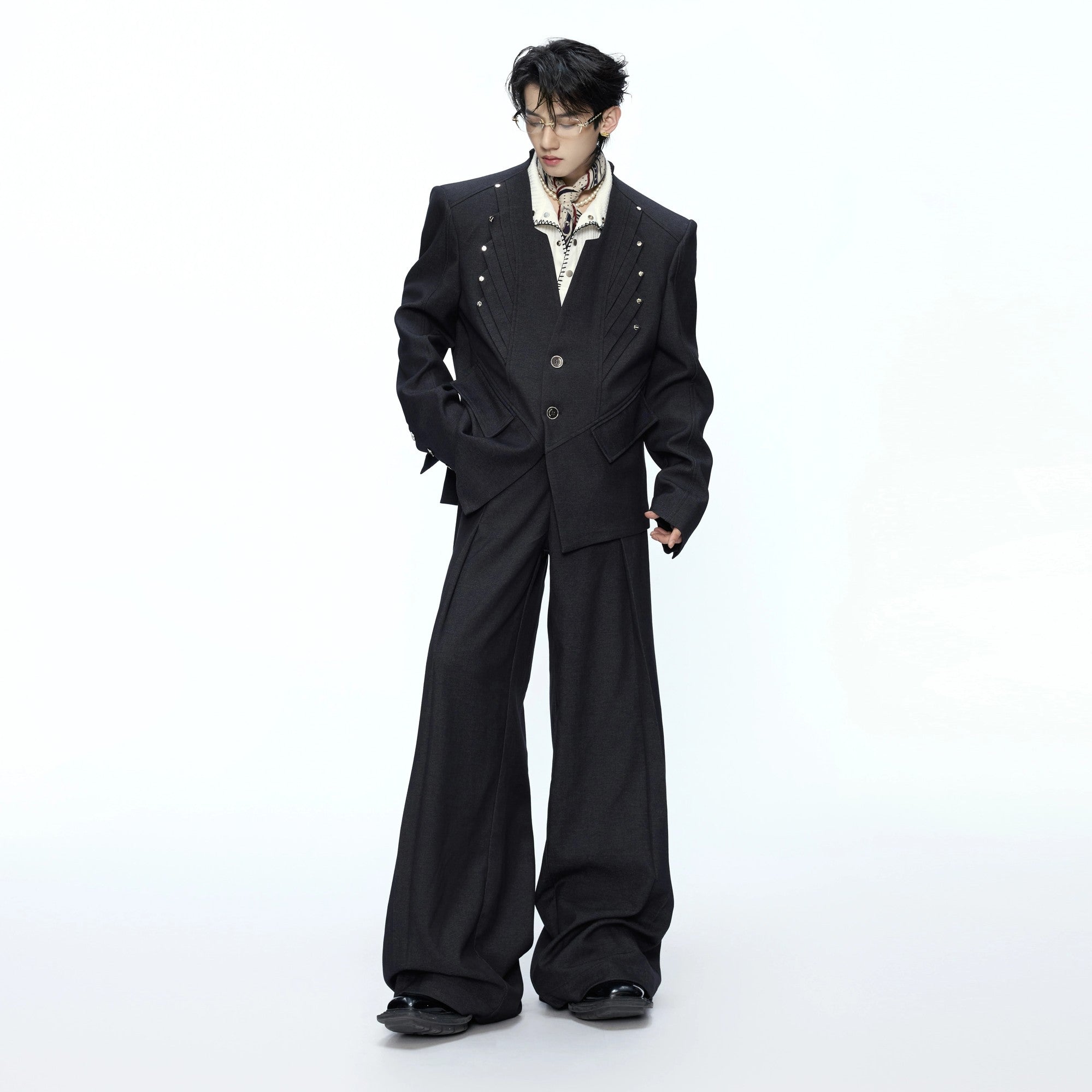 Close-up of silver rivet metal decorations on a stand collar blazer