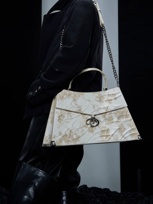 Niche white streetwear shoulder bag in trapezoid shape