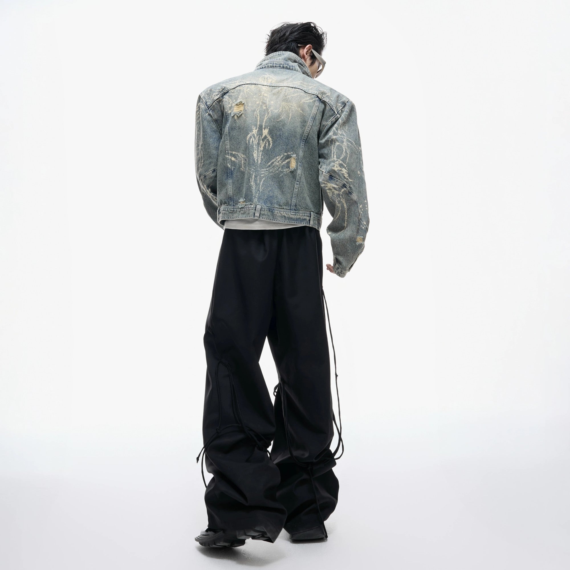 Close-up of the heavywork burnout and ripped fabric details