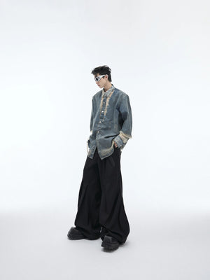 Lifestyle shot of the avant-garde deconstructed denim shirt in light blue.