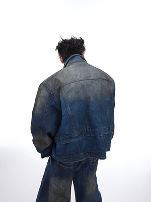 Side profile of loose fit distressed denim pants showing the gradient wash.