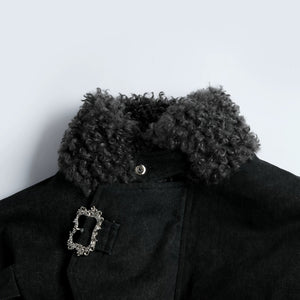 Engraved vintage metal button details on washed cotton fabric