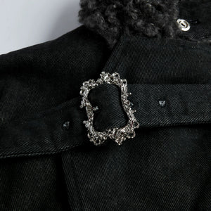 Model wearing oversized fur collar parka in urban setting