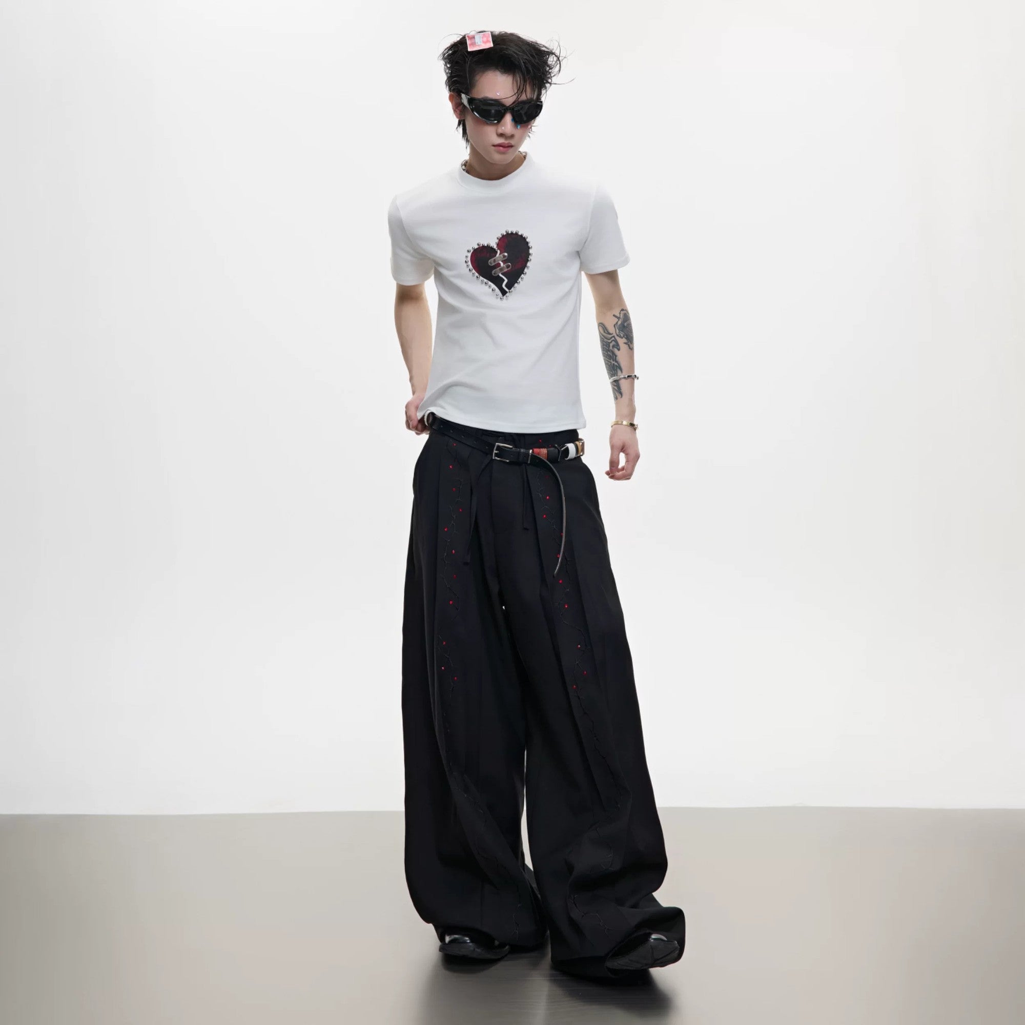 Close-up of 100% metallic beads on a distressed heart graphic