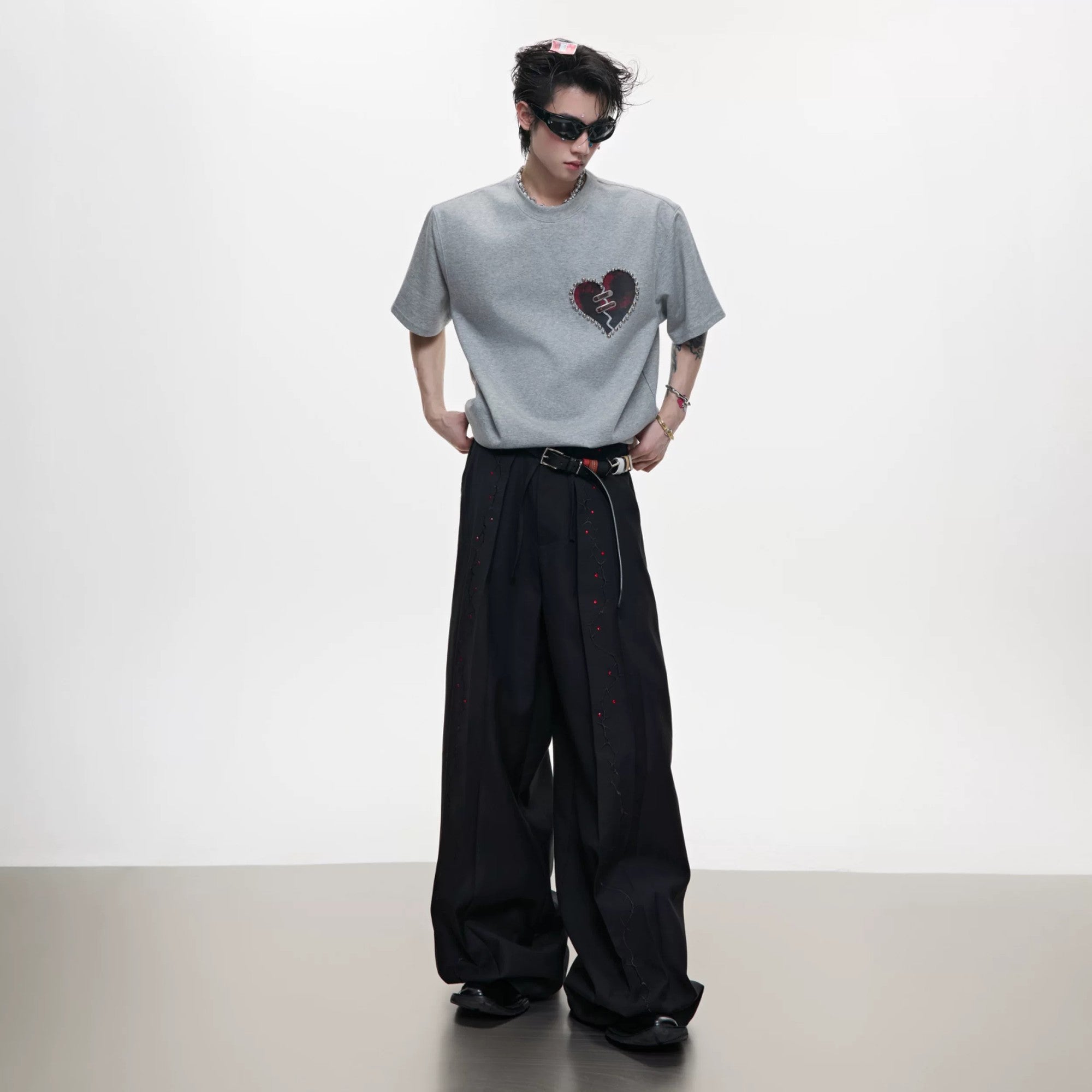 Collection of gray, black, and white heartbeat loading tees