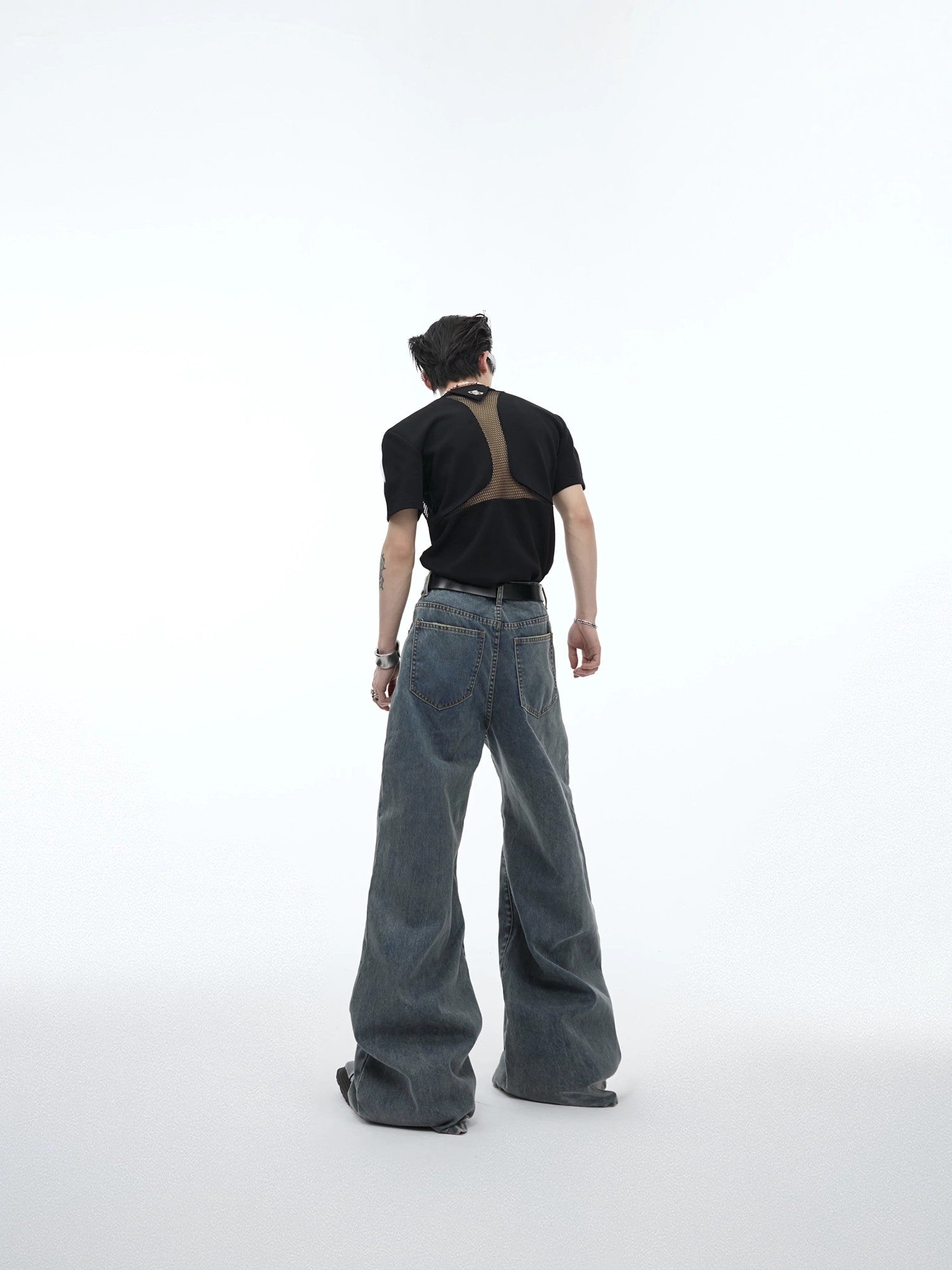 Back view showing the fit and high-waist design of the flare jeans