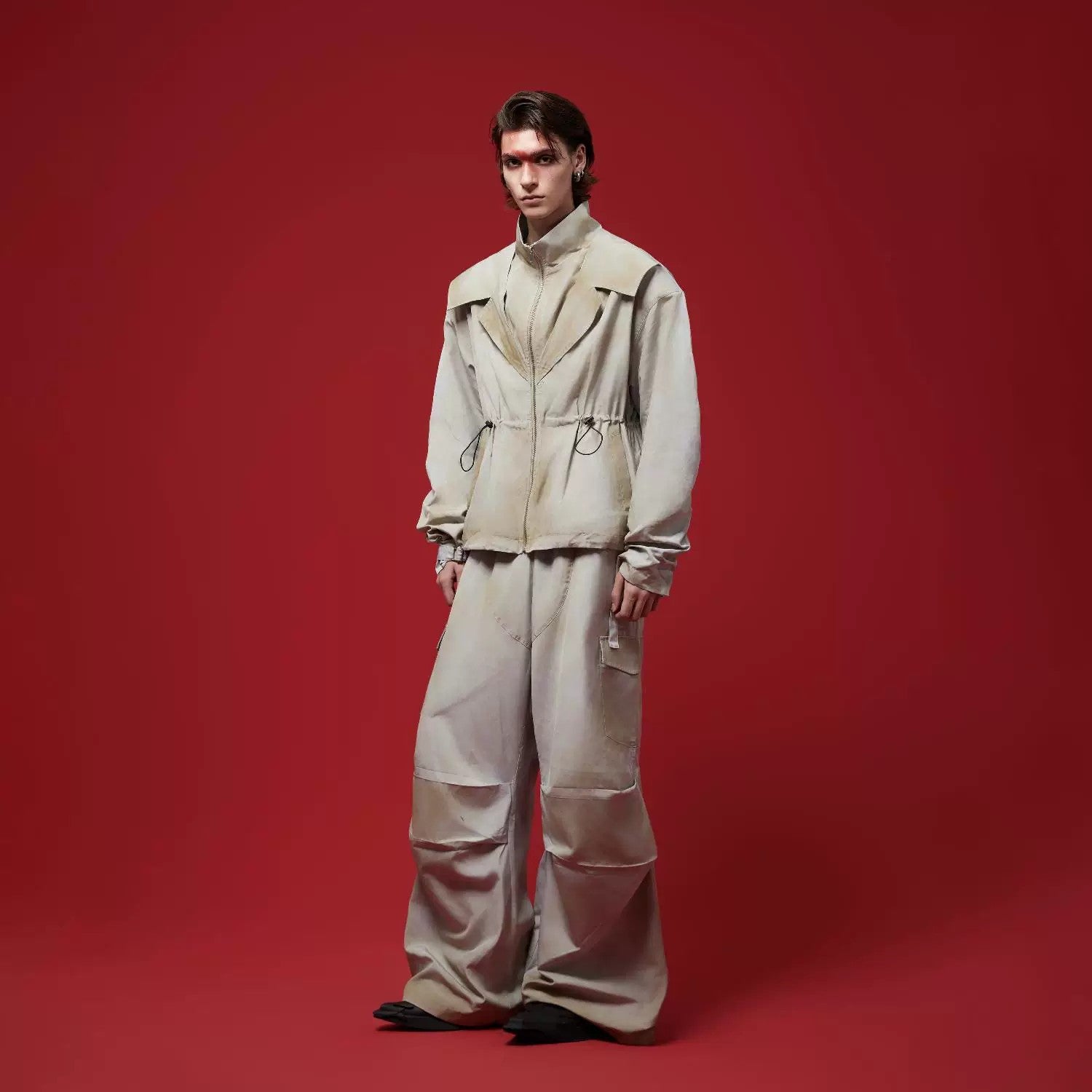 Close up of the zipper and collar on deconstructed tech jacket