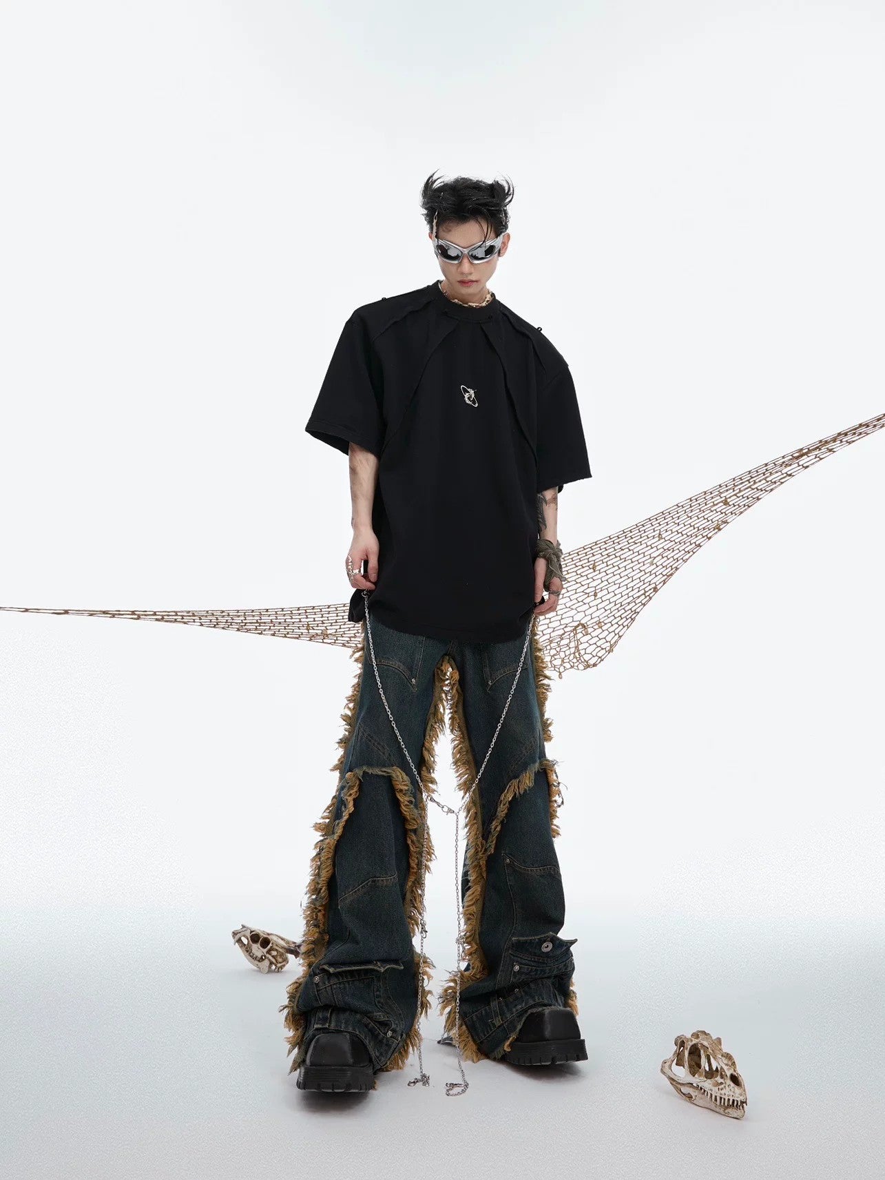 Close up of metal chain accessory on distressed fabric