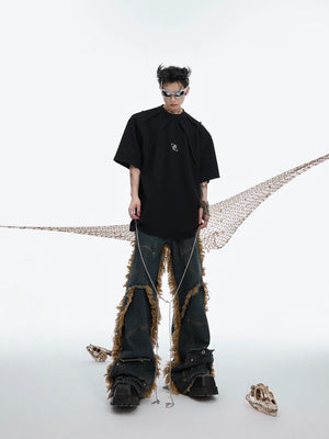 Close up of metal chain accessory on distressed fabric