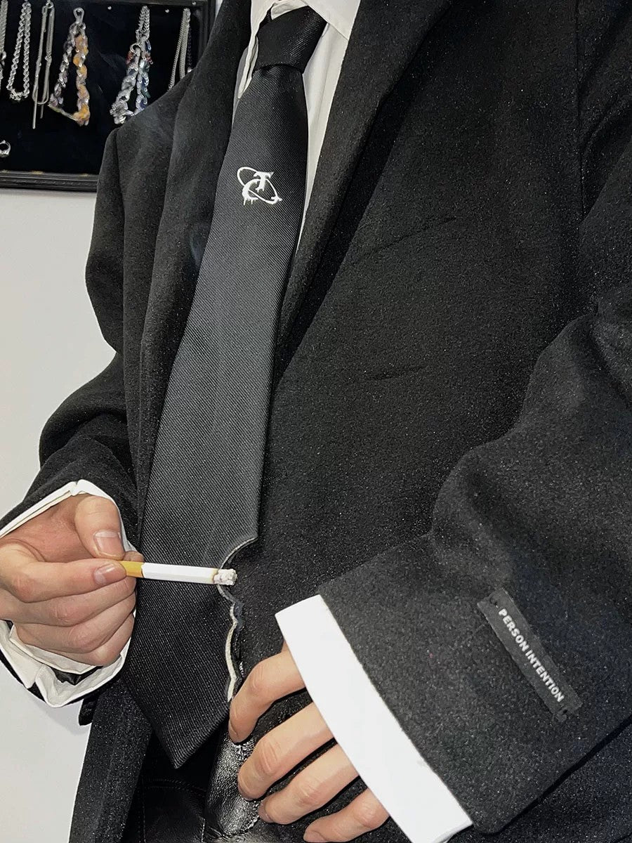 Men's streetwear tie with distressed edges and metal logo in black