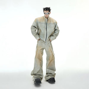 Distressed denim jacket with pearl accents and metal zippers front view