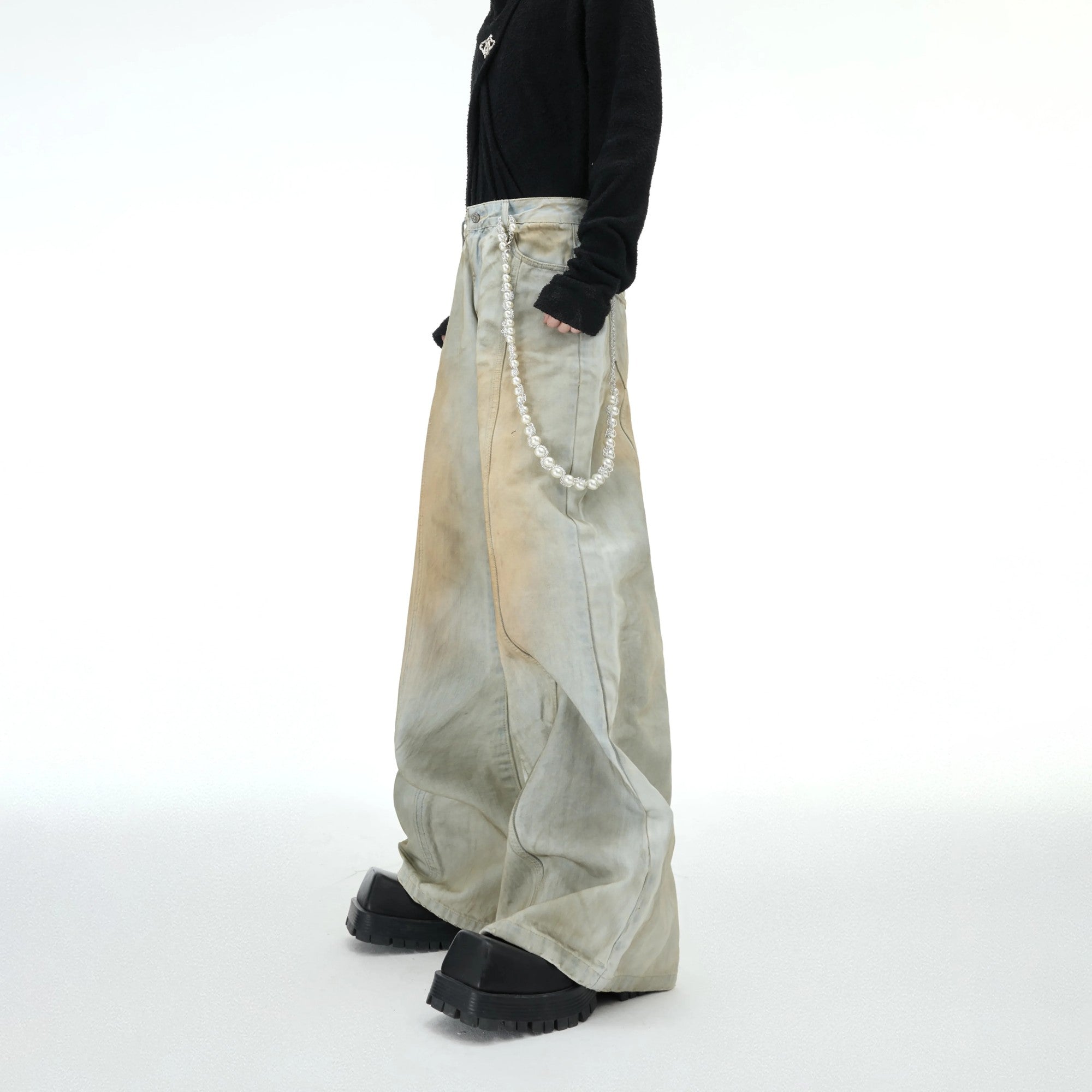 Back view of loose fit distressed denim jacket streetwear style