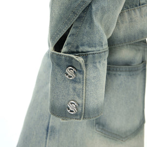 Side view of loose fit washed denim pants showing the distressed texture