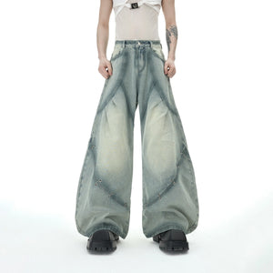 Model wearing the distressed denim set in an urban street setting