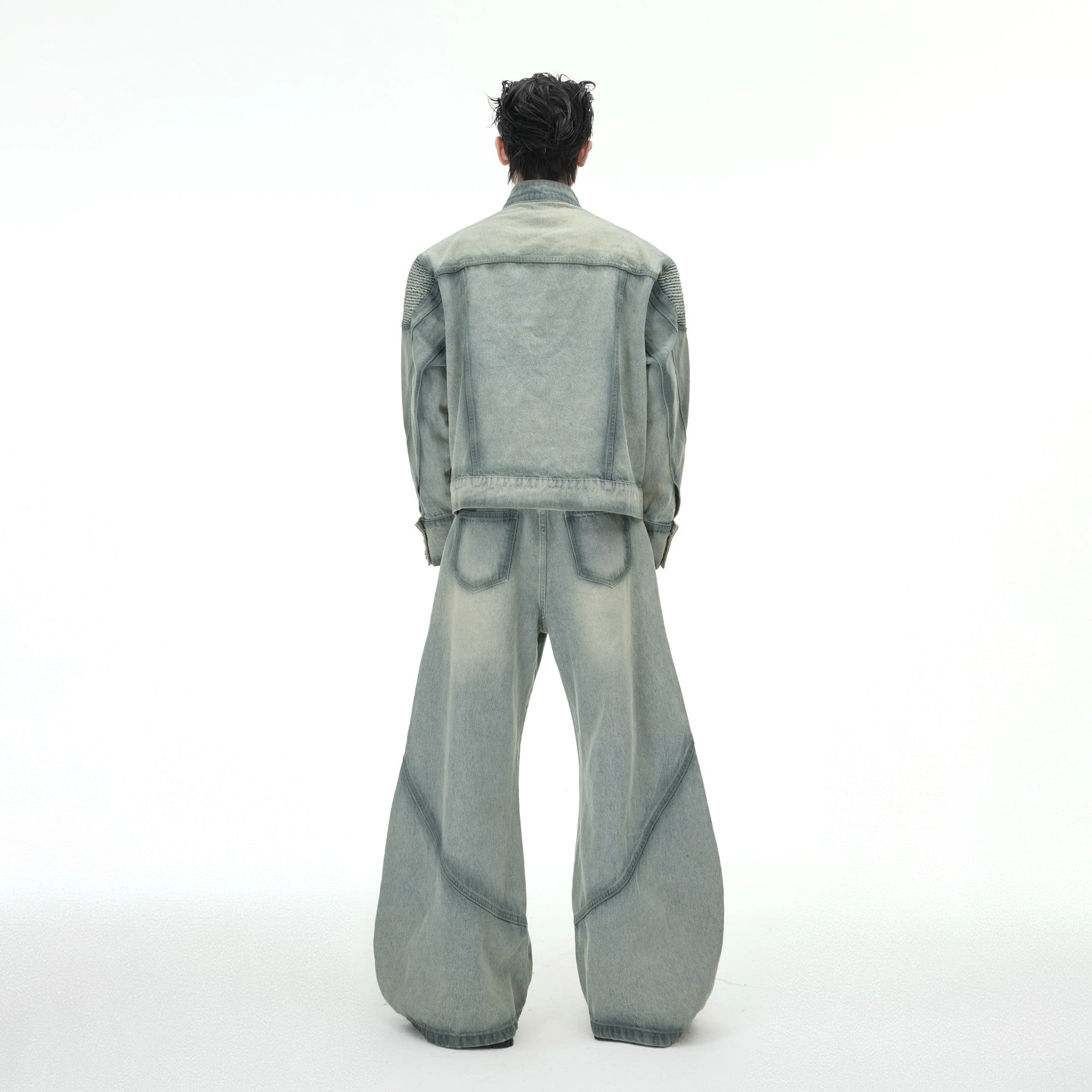 Back view of the stand collar distressed denim jacket with arc seams