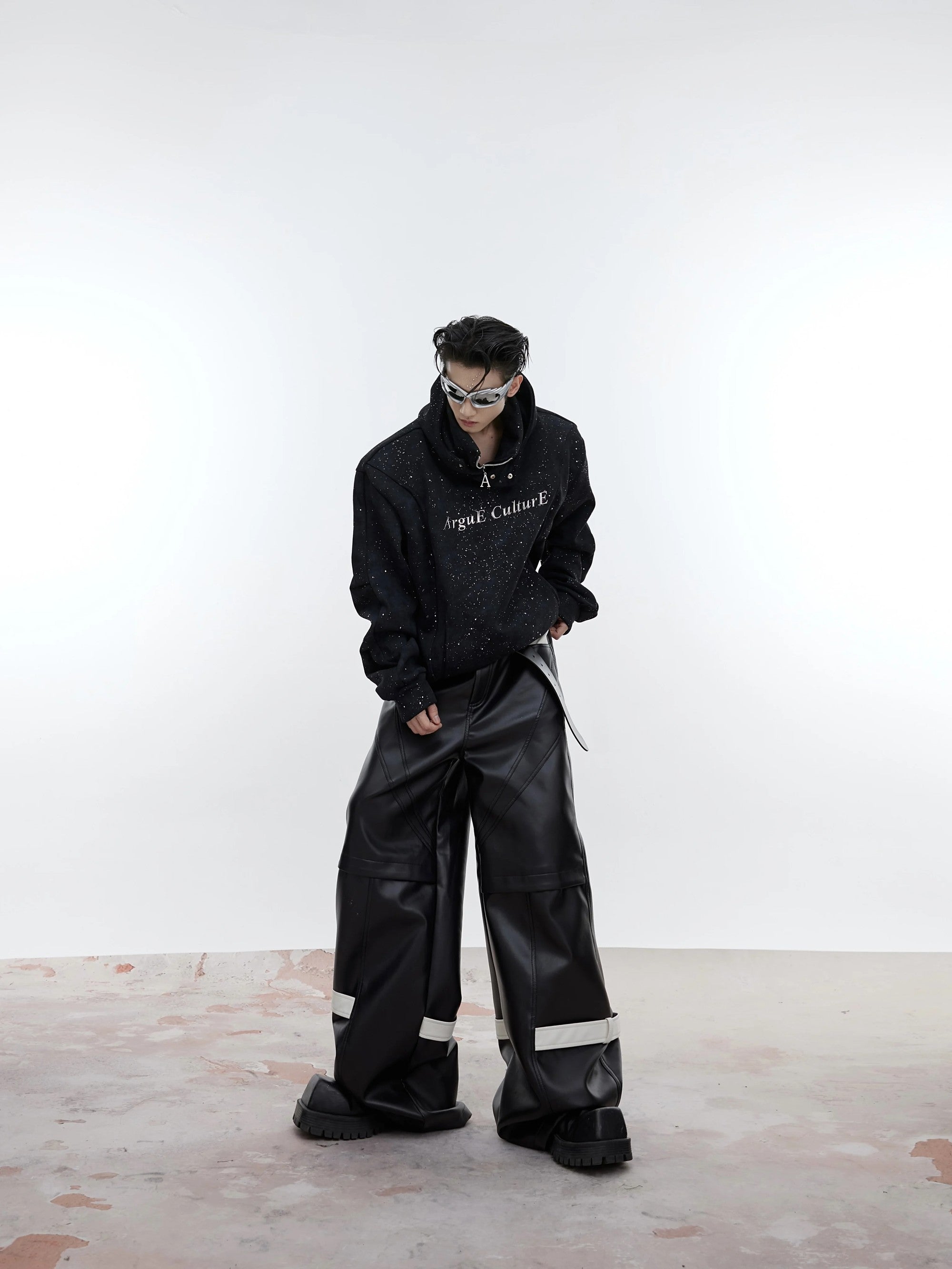 Model wearing the oversized shimmer hoodie in an urban street setting