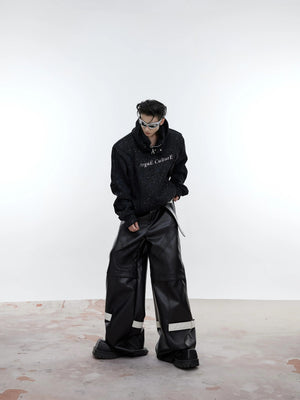 Model wearing the oversized shimmer hoodie in an urban street setting