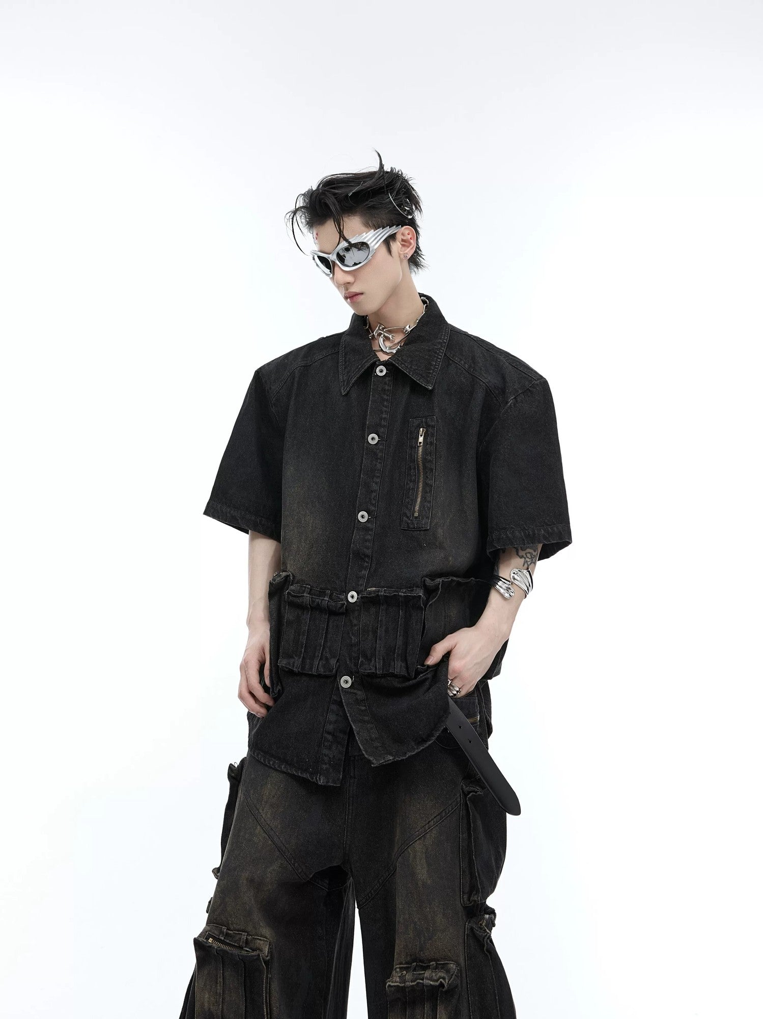 Front view of a distressed blue short sleeve denim jacket with tie-dye effect