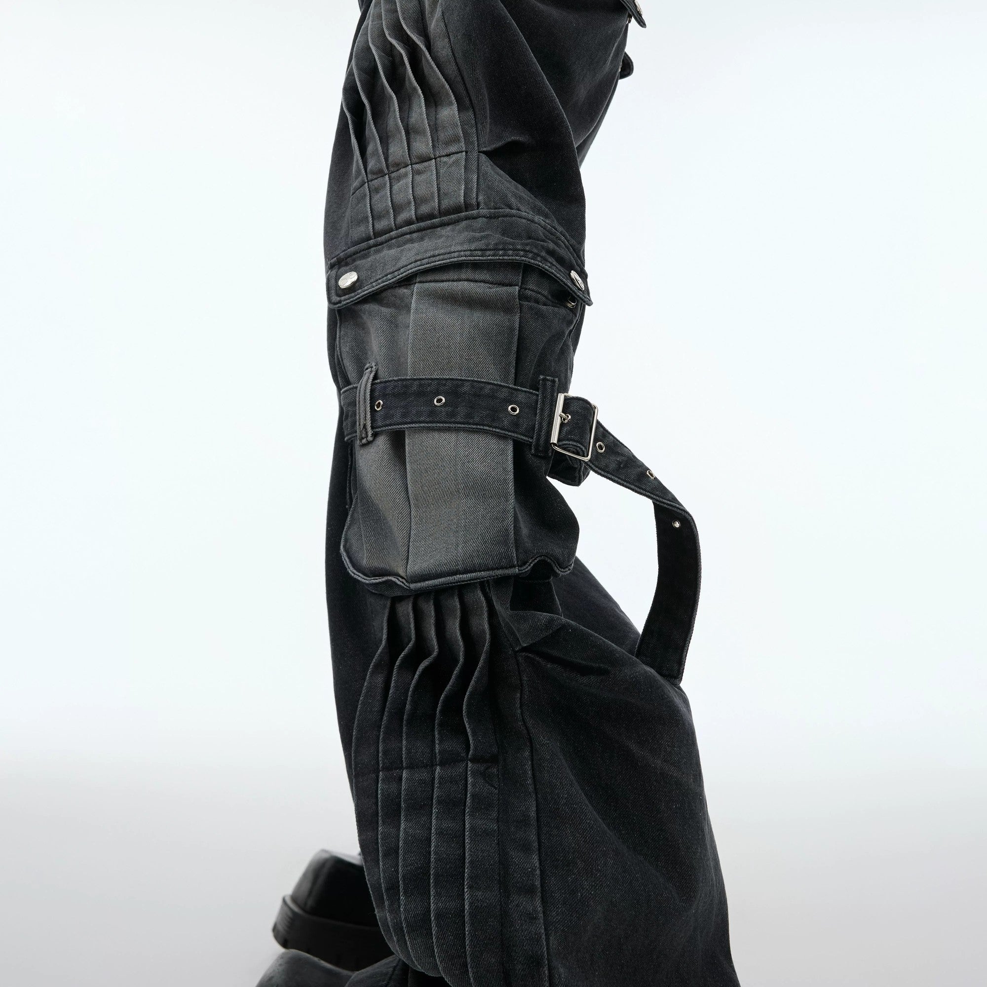 Detailed shot of the stone wash and pleated design on denim