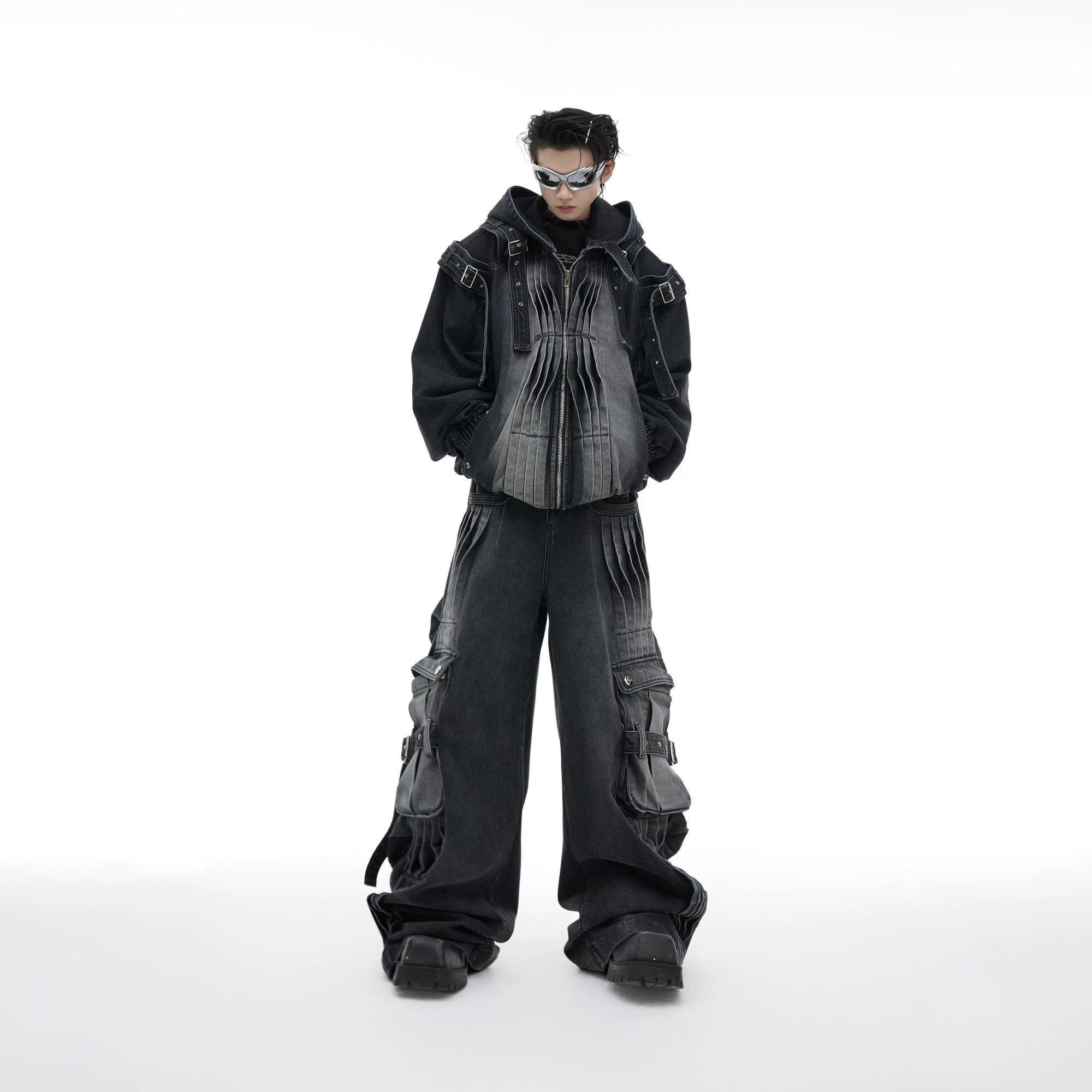 Model wearing black distressed cargo pants with streetwear style