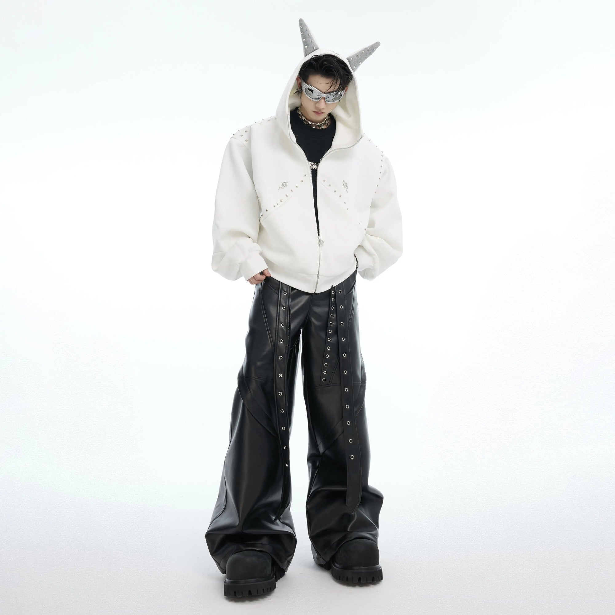 Couple wearing matching Doberman studded hoodies in street setting