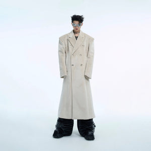 Front view of a man wearing a black oversized double-breasted woolen coat