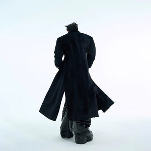 Close-up of silver metal buttons on a heavyweight woolen coat