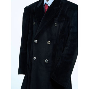 Detailed shot of the oversized flap pockets on the woolen coat