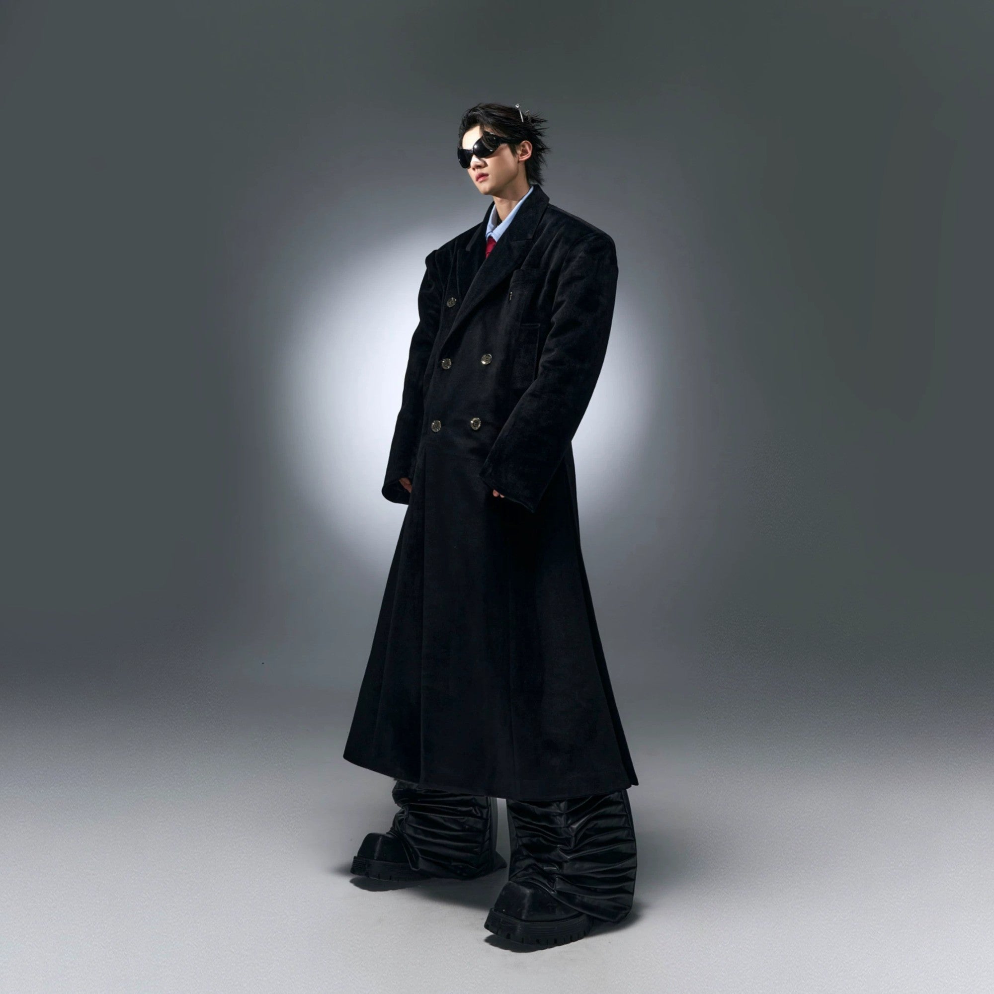 Full body shot of a streetwear outfit featuring the oversized woolen coat