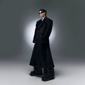 Full body shot of a streetwear outfit featuring the oversized woolen coat
