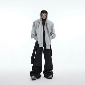 Close-up of the faux two-piece layering and vintage buttons on gray hoodie