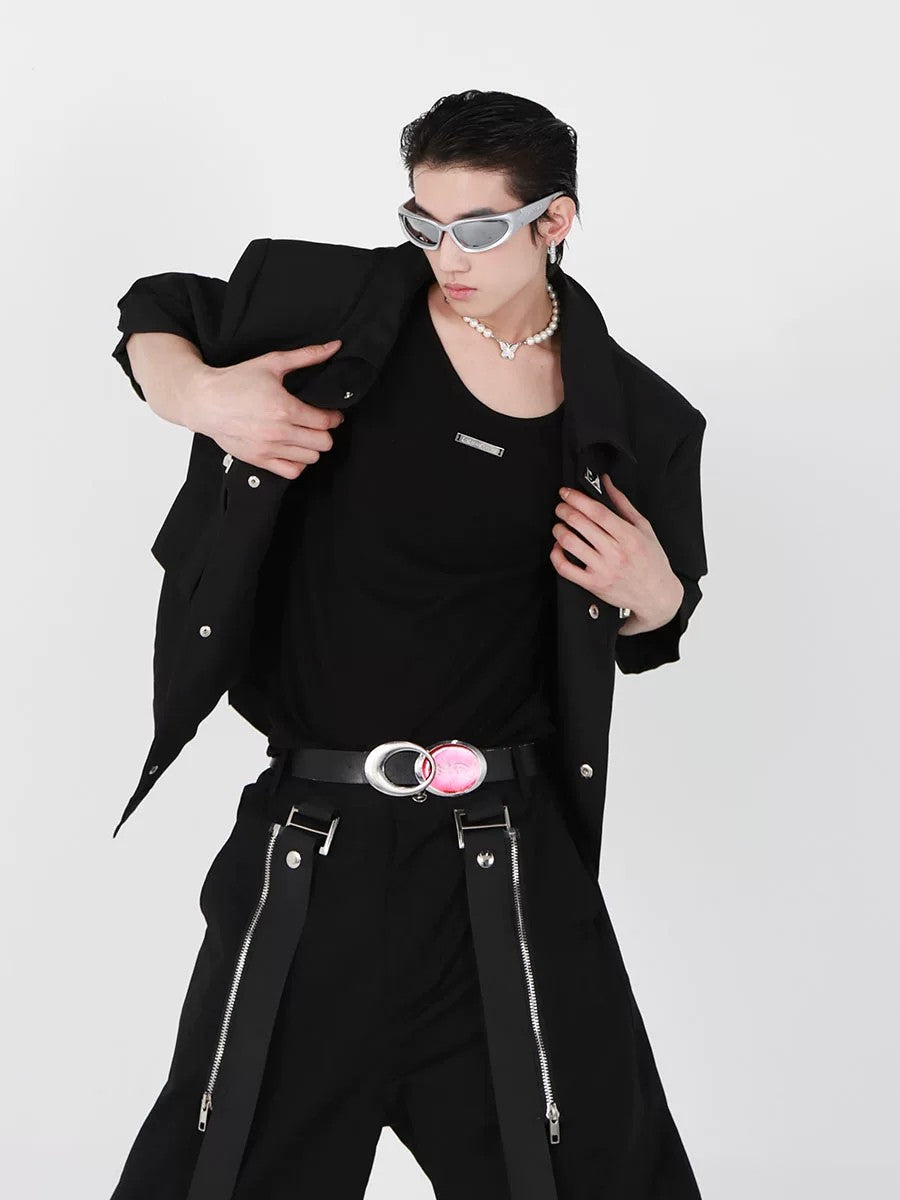 Model wearing double strap black vest in an urban street setting