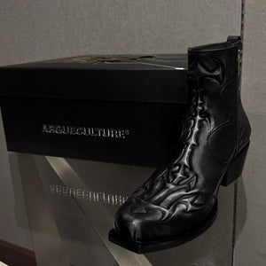 Close-up of the embossed spine totem and distressed cracked leather texture