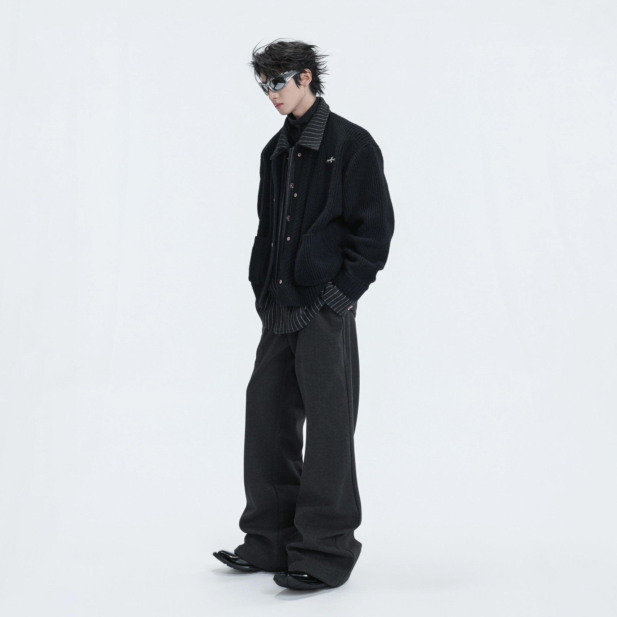 Macro shot of the luxury jewel-encrusted metal buttons on the cardigan