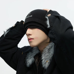 Model wearing the triple layer beanie in a winter urban setting