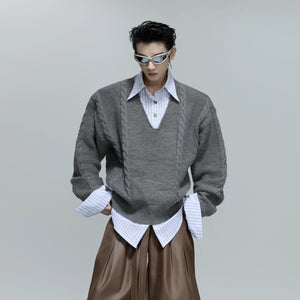 Front view of an oversized gray faux two-piece cable knit sweater