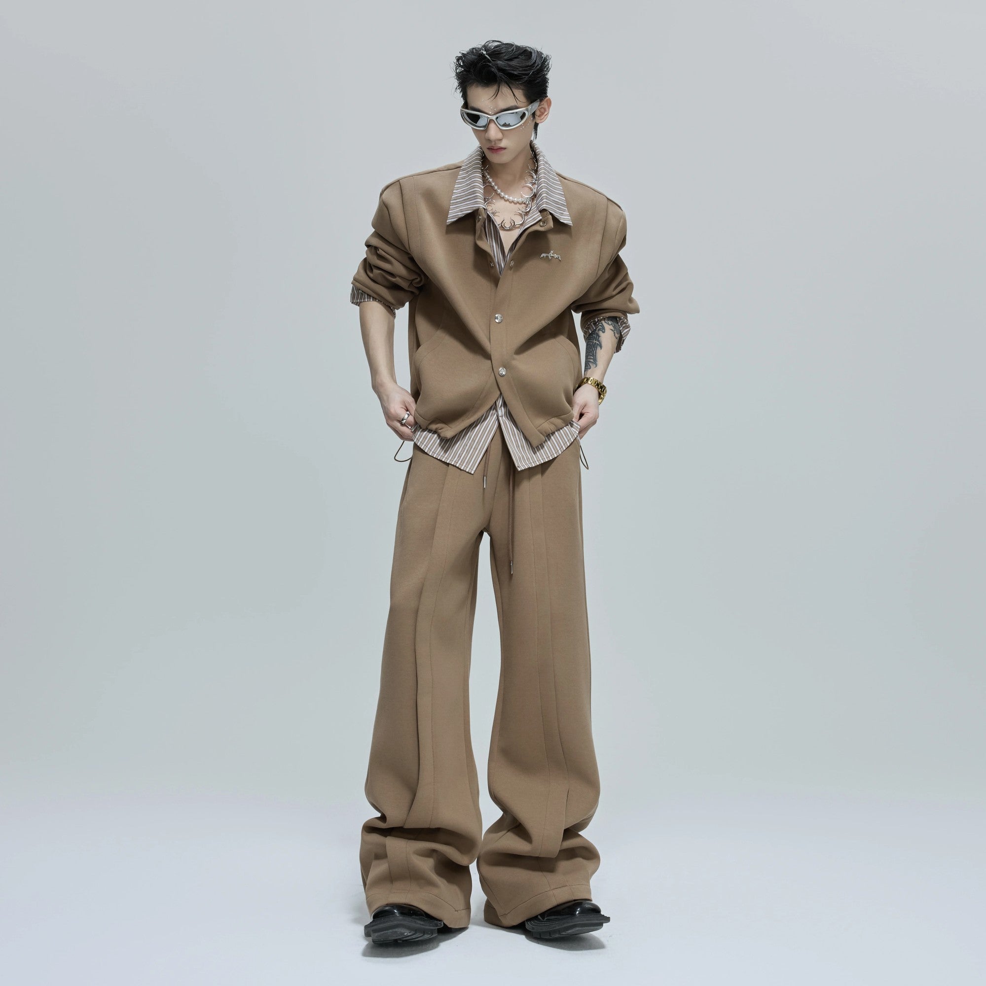 Close-up of the striped shirt layering detail and stand collar