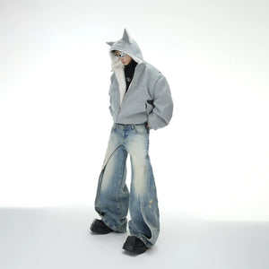 Male model wearing the reversible fox ear jacket in an urban street setting.