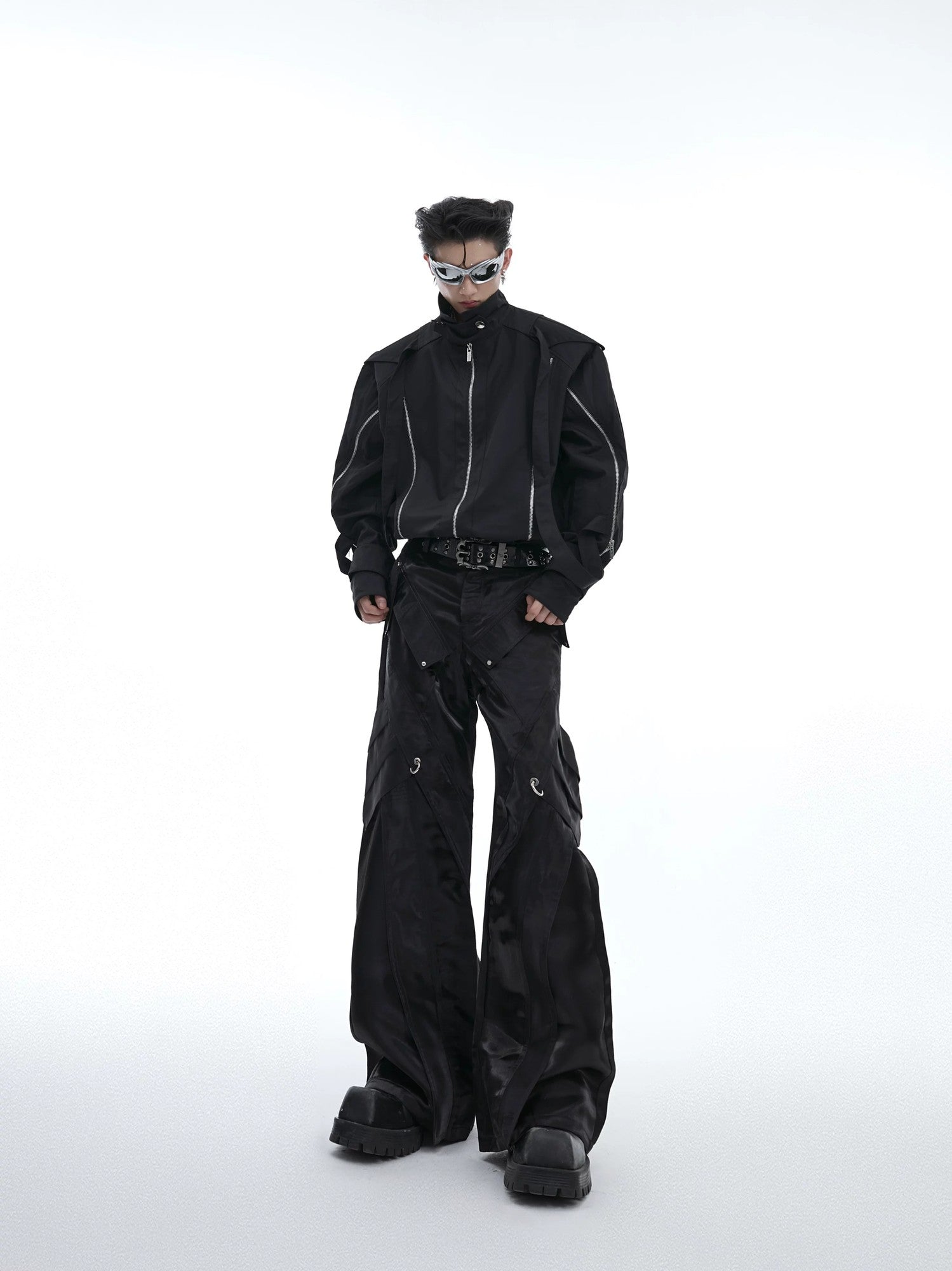 Lifestyle shot of the futuristic liquid shine pants in an urban street setting.