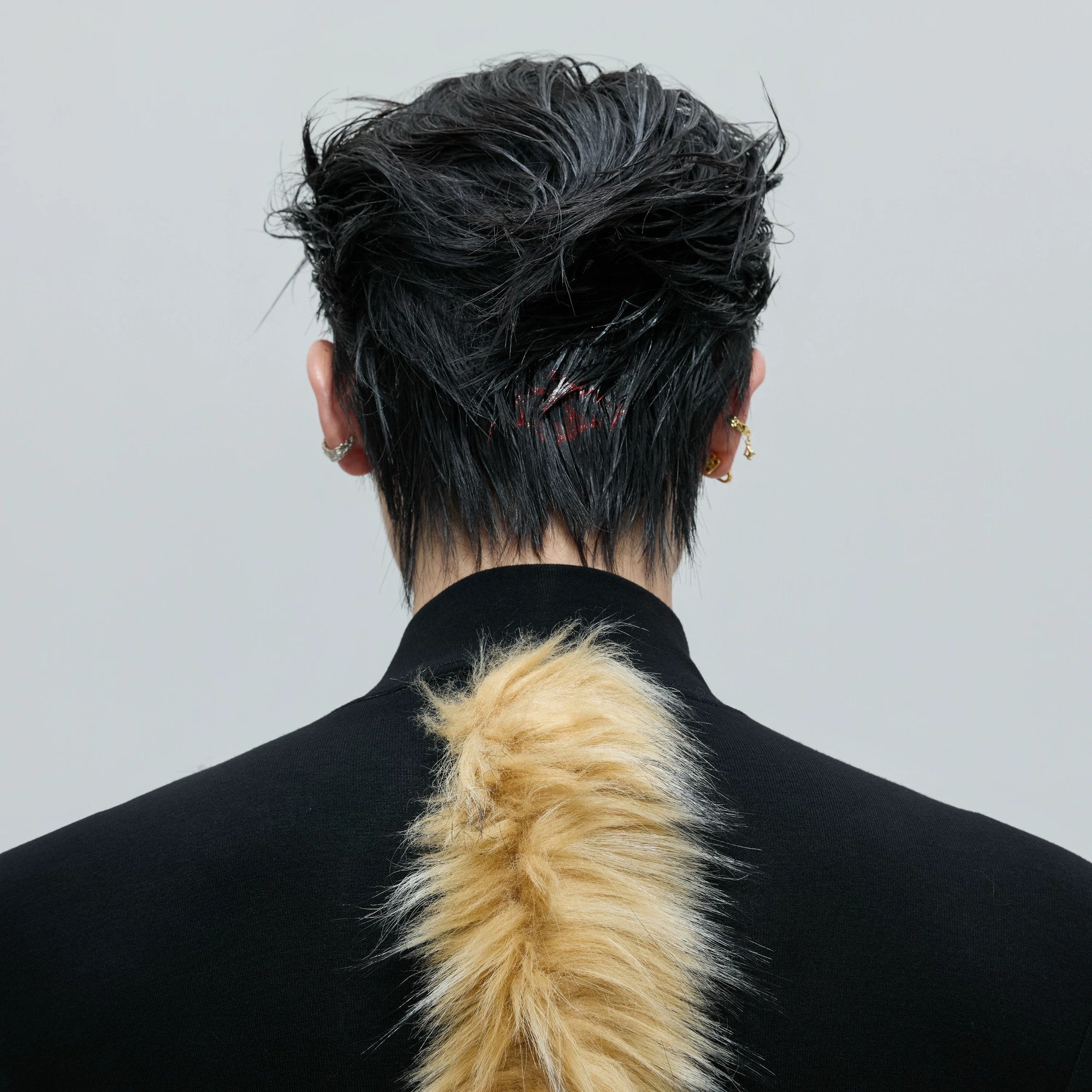 Close up of silver hardware and raccoon fur texture on shoulder