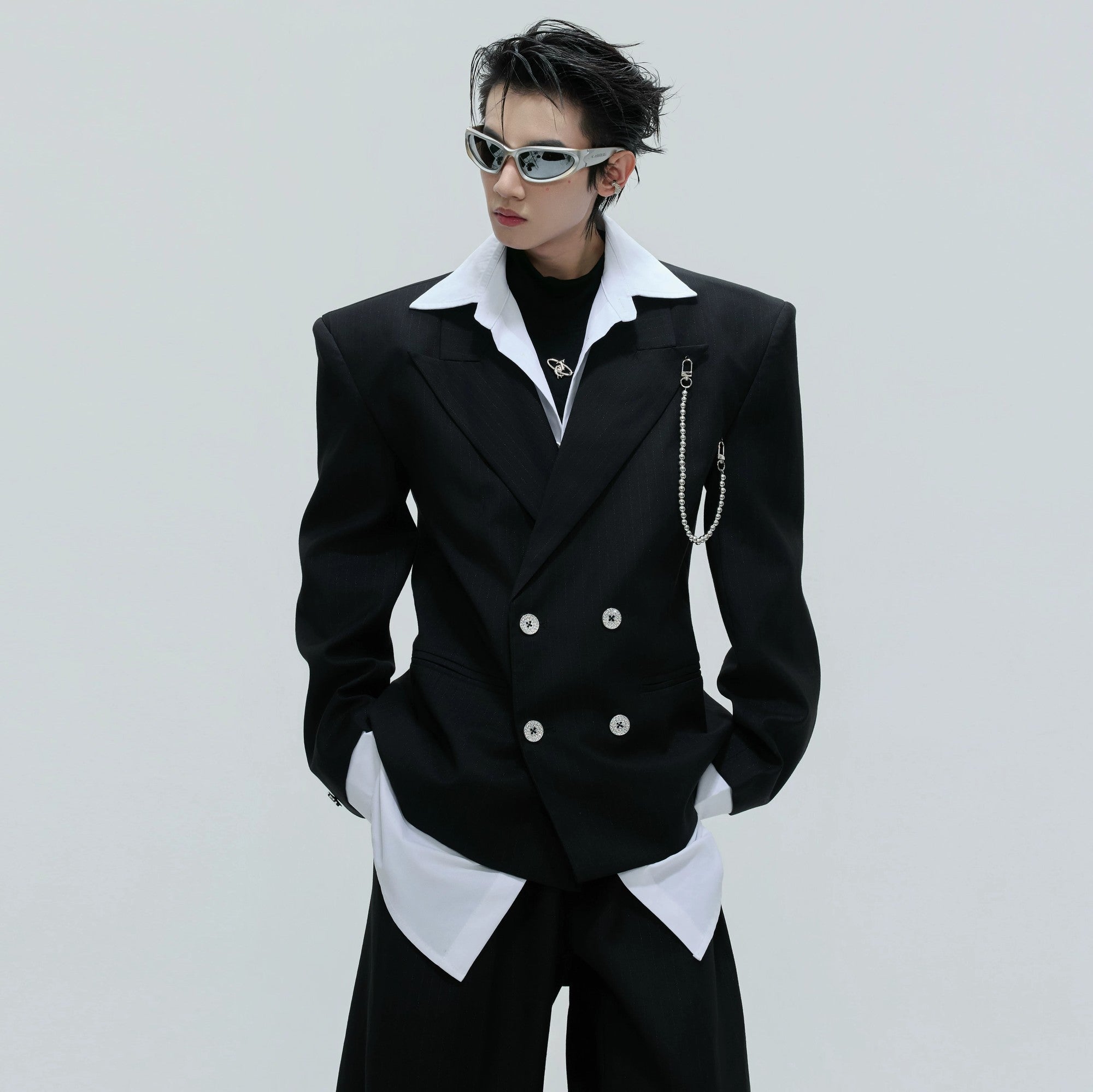 Back view showing the loose fit and padded shoulders of the blazer