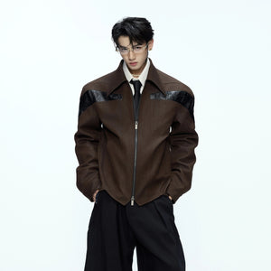 Close-up of the textured leather and patchwork stitching details.