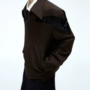 Male model wearing the deconstructed cropped jacket with baggy pants.