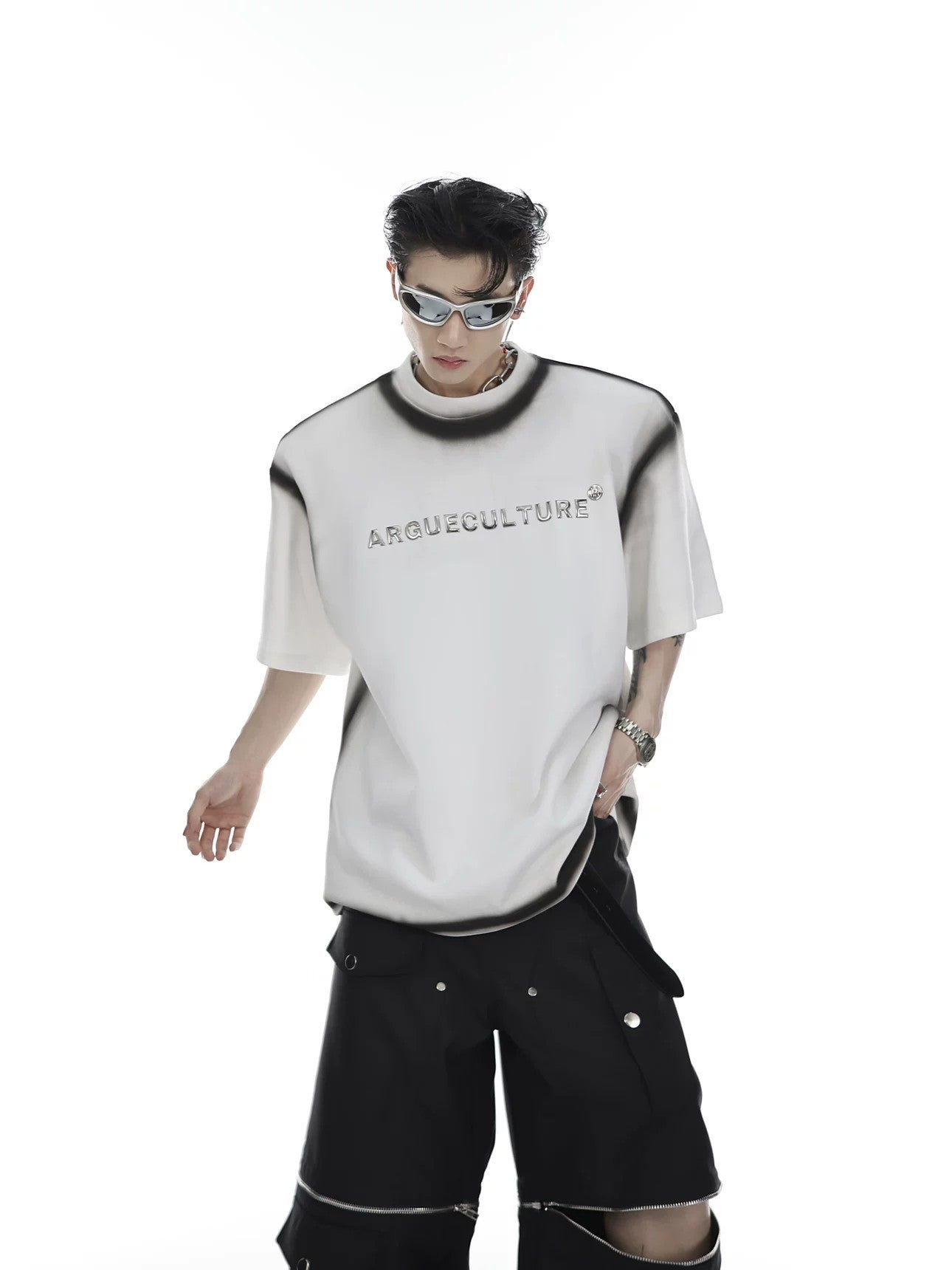 Front view of black cyberpunk tee with metal studs and shoulder pads