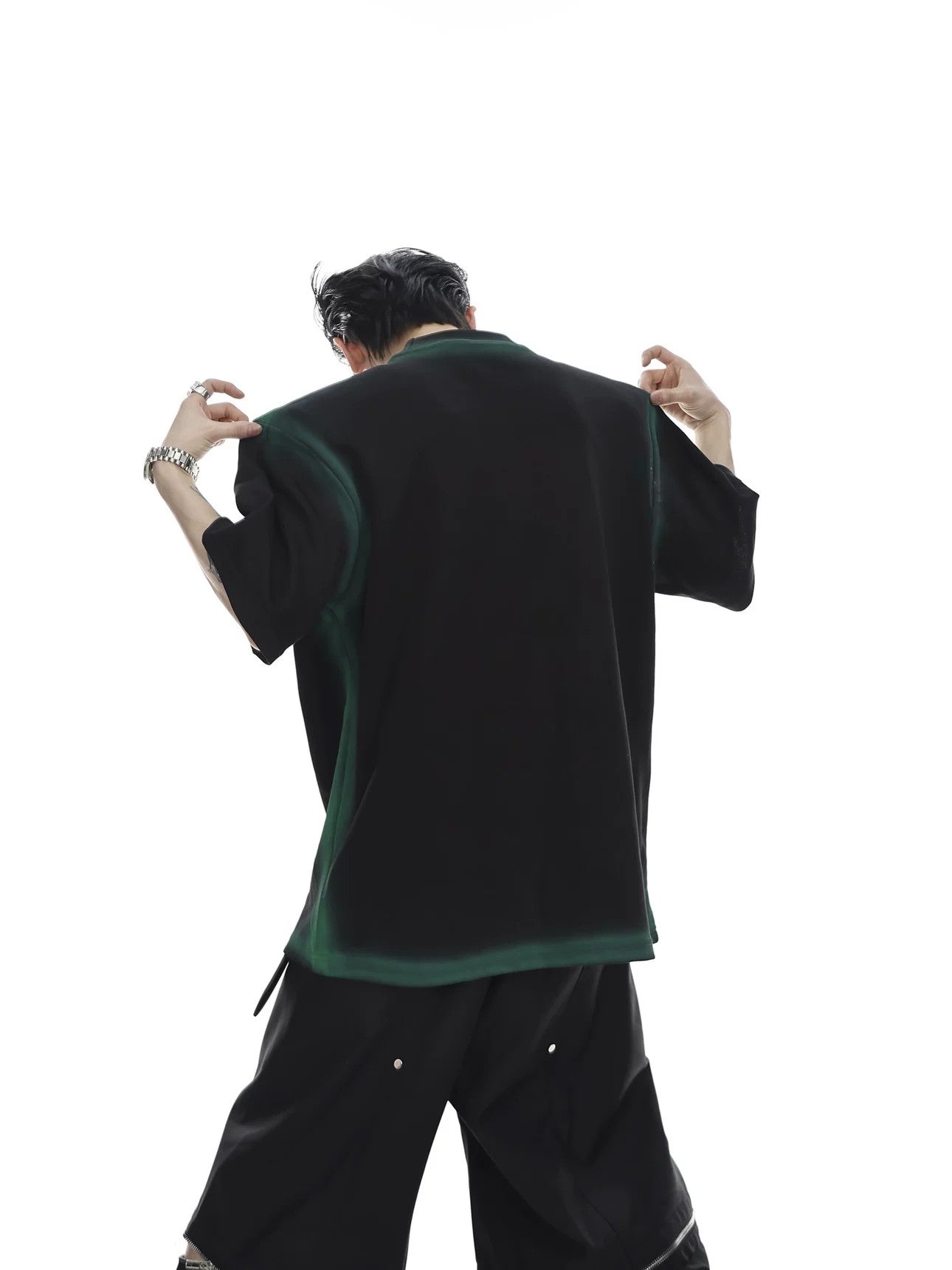 Side view showing the structured shoulder pad silhouette of the tee