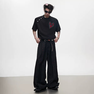 Model wearing white deconstructed tee with embroidery and rhinestones