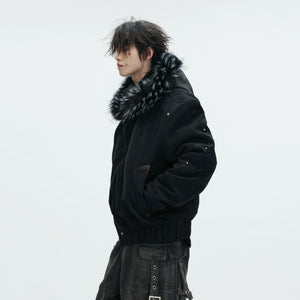 Model wearing a heavy embroidered leather jacket in a street setting