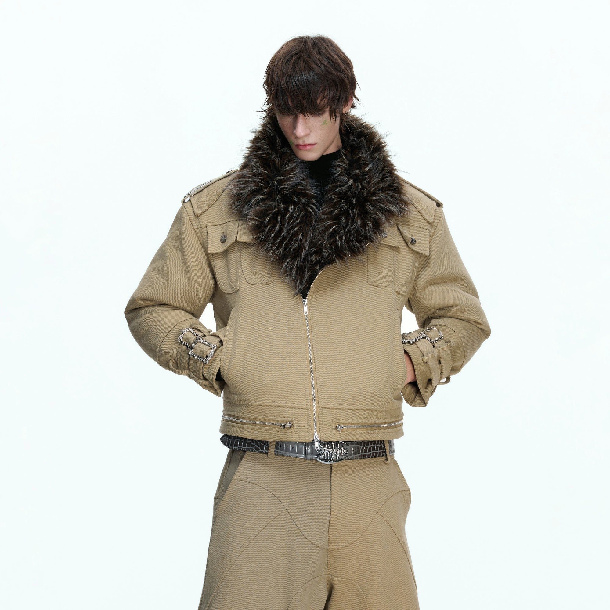 Front view of a beige heavy washed canvas work jacket with patchwork details.