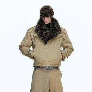 Front view of a beige heavy washed canvas work jacket with patchwork details.