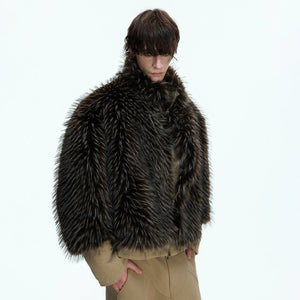 Back view of the beige patchwork canvas jacket showing the boxy silhouette.